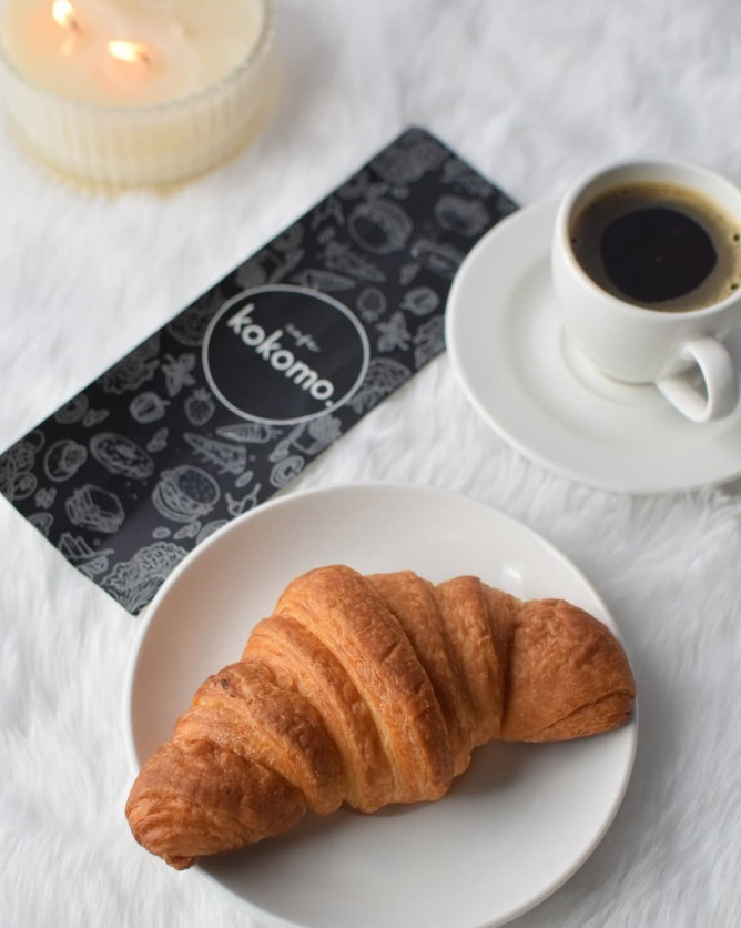 Baked Cheesecake Slice next to Cafe Kokomo Bookmark