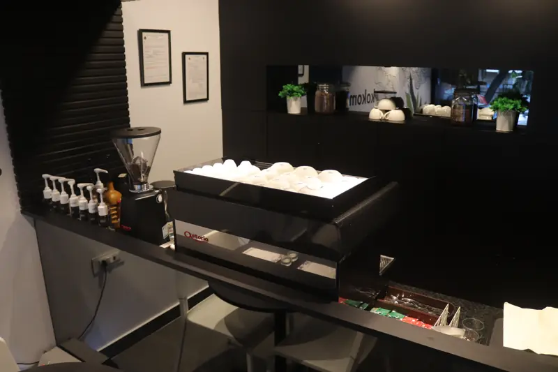 The coffee bar with grinder and cups