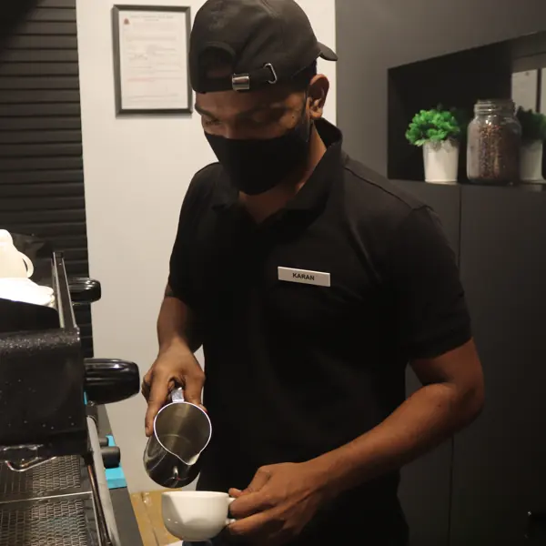 Barista pouring latte art